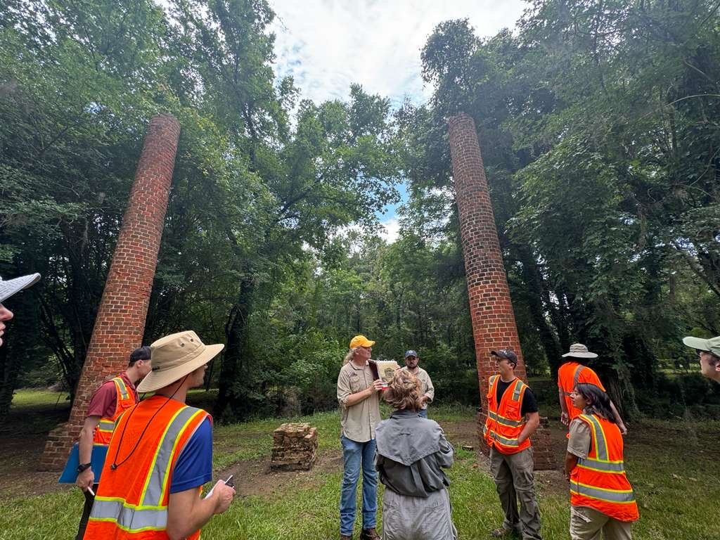 Participants gather for field instruction among historic brick remains at Old Cahawba