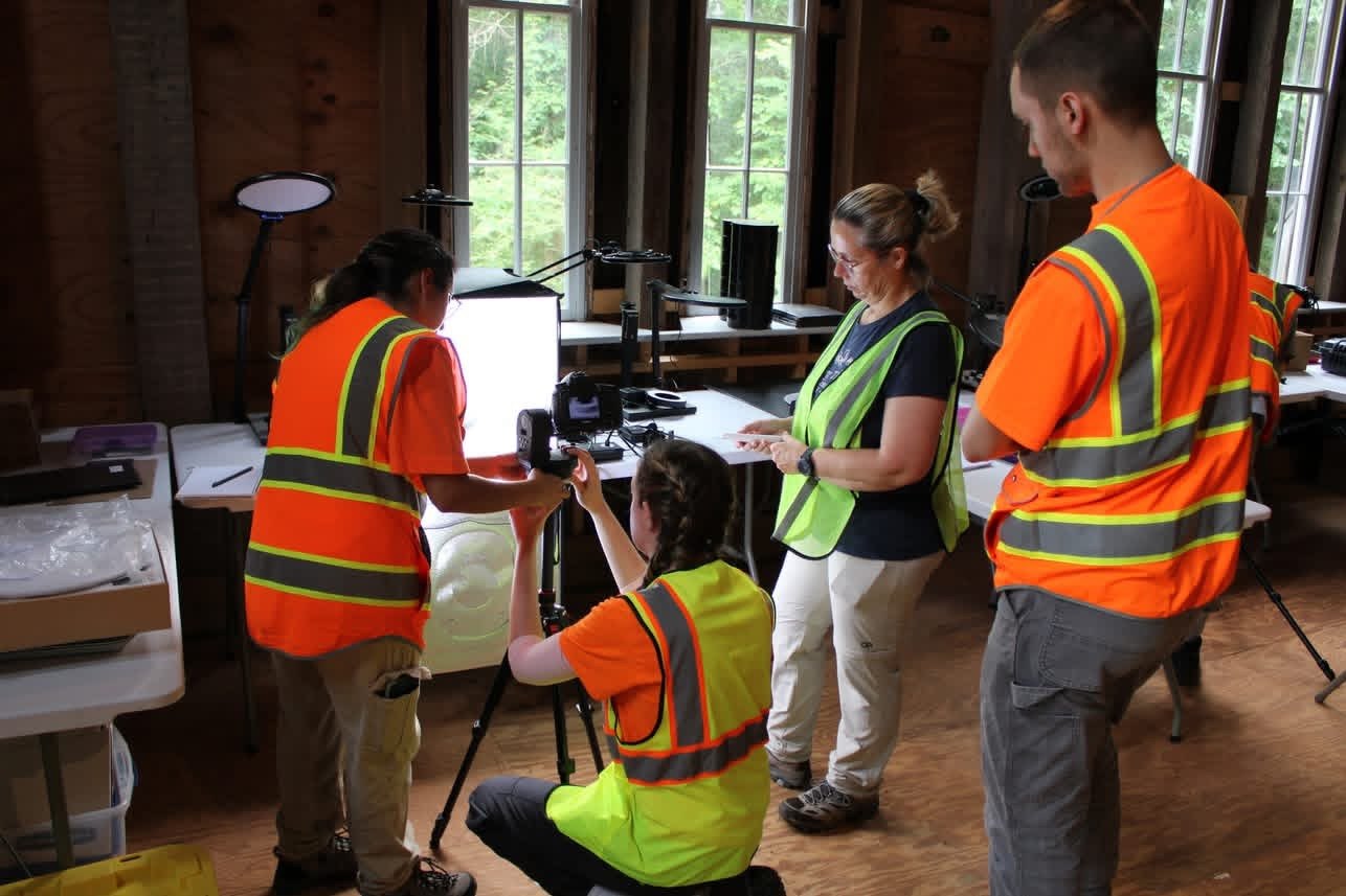 Participants practice controlled photographic recording around a camera setup